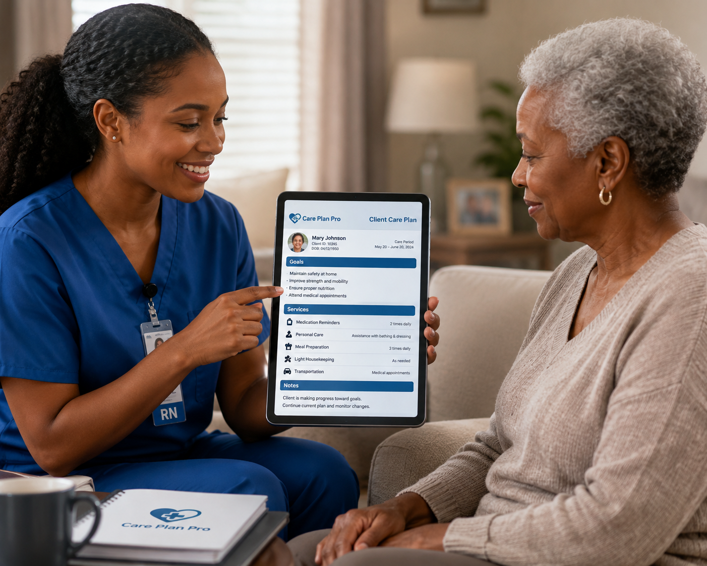 Caregiver in blue scrubs reviewing a CarePlan Pro - Homecare client care plan on a tablet with an older adult client at home